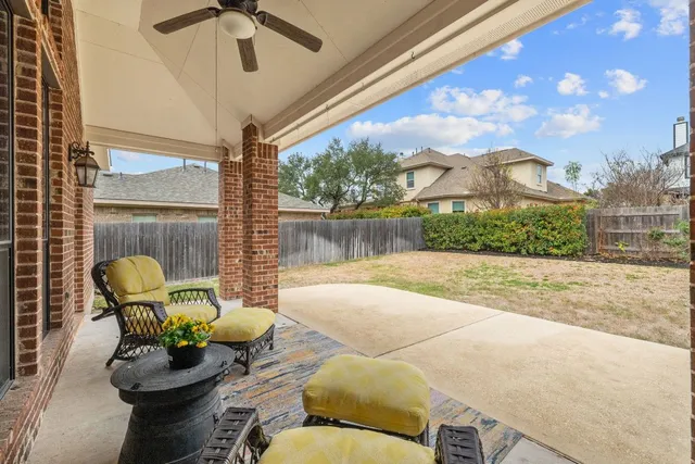 a view of a patio with couches chairs and a potted plant