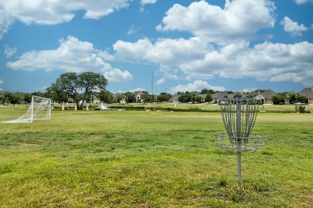 a view of a golf course with a fountain