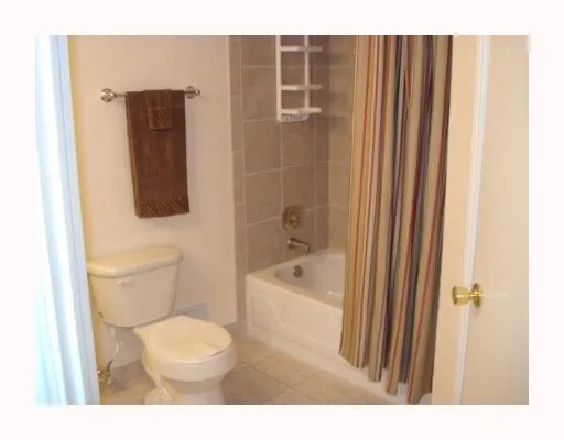 a bathroom with a toilet a sink and bathtub