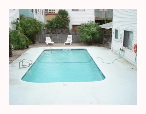 a backyard of a house with outdoor seating