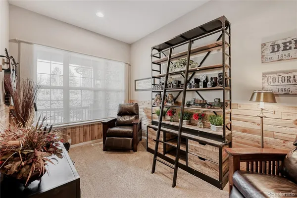 a spacious bedroom with a bed and a window