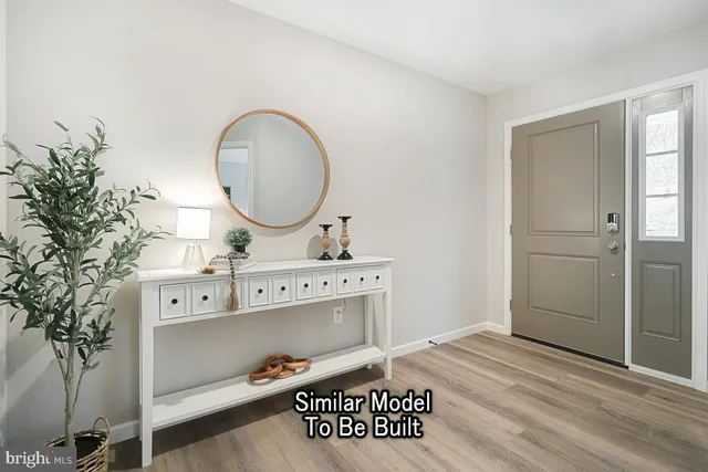 a bathroom with a sink mirror and vanity