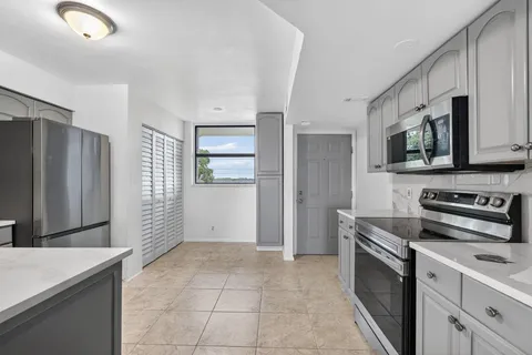 a living room with furniture window and a mirror