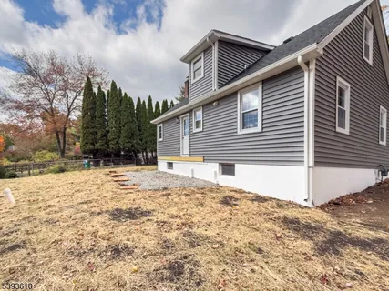 a house with a yard covered in snow