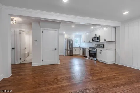 a view of kitchen with wooden floor