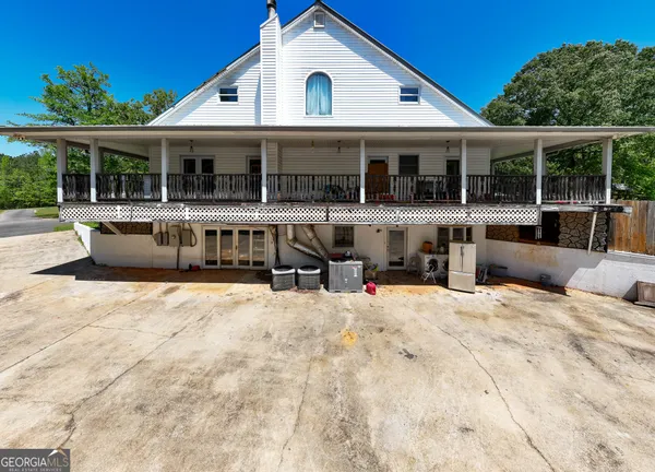 a backyard of a house with wooden fence