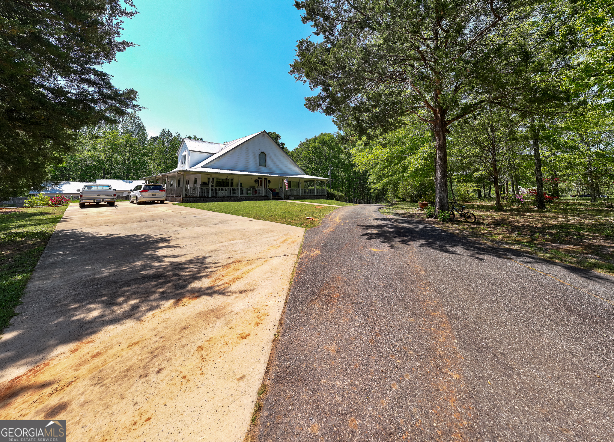 324-acres Hunsinger Road Shiloh, GA 31826 - Photo 46 of 62 a yellow and red house with trees in the background