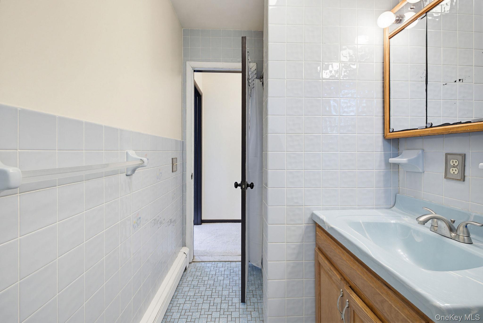 12 Bradhurst Road Carmel, NY 10512 - Photo 20 of 28 a bathroom with a sink and a mirror