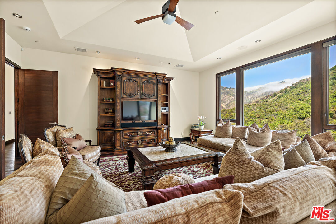 25155 Piuma Road Malibu, CA 90265 - Photo 12 of 29 a living room with furniture and a large window