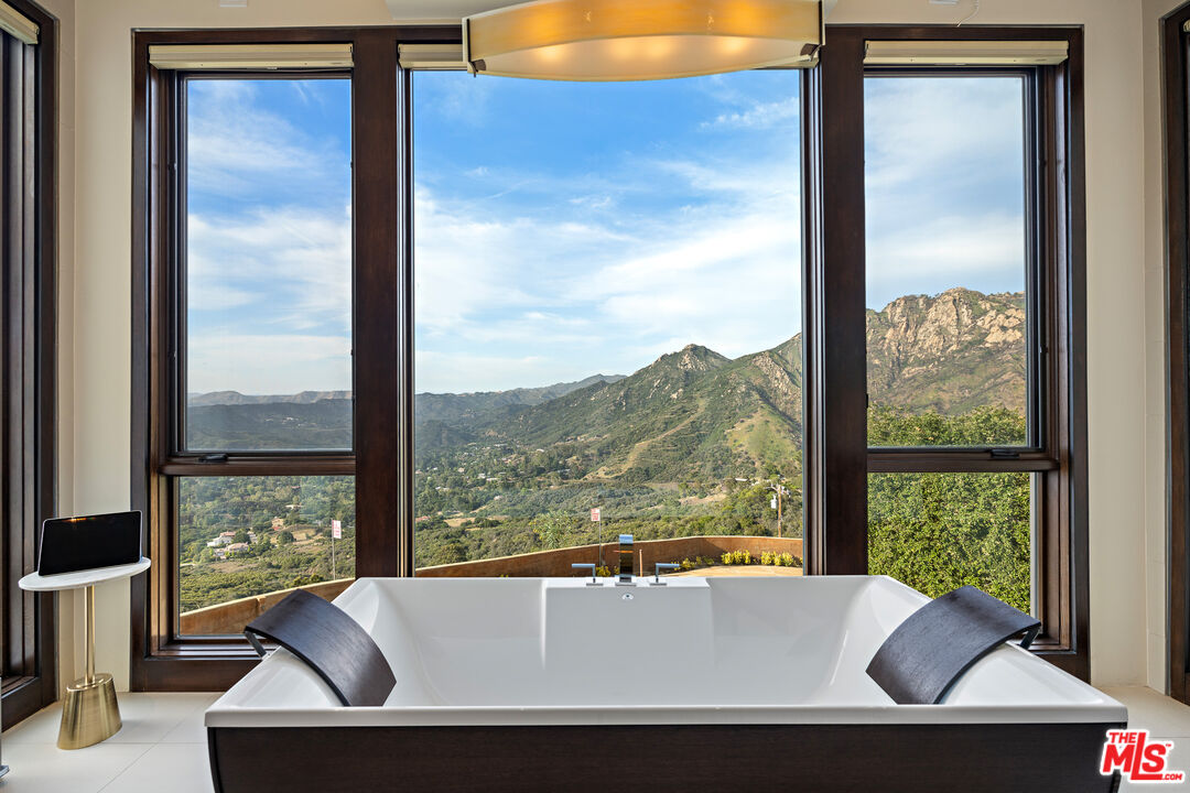 25155 Piuma Road Malibu, CA 90265 - Photo 15 of 29 a view of a living room and a window