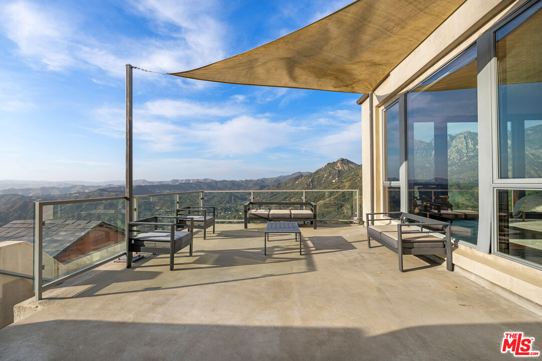 25155 Piuma Road Malibu, CA 90265 - Photo 21 of 29 a building outdoor space with patio and furniture