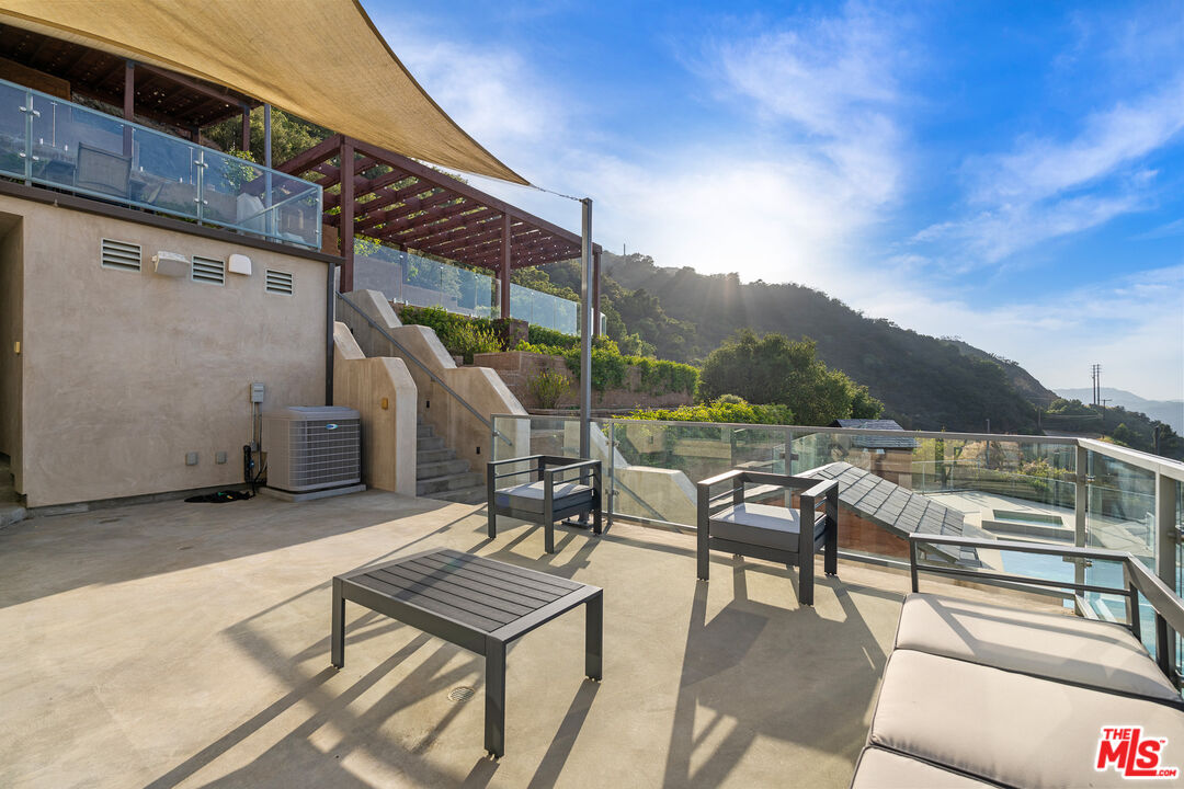 25155 Piuma Road Malibu, CA 90265 - Photo 22 of 29 a backyard of a house with outdoor seating