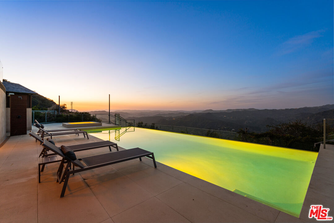 25155 Piuma Road Malibu, CA 90265 - Photo 26 of 29 a view of swimming pool with lounge chairs