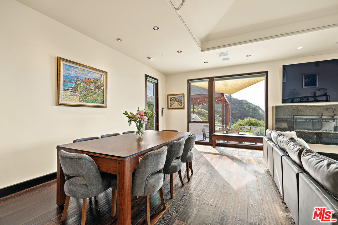 25155 Piuma Road Malibu, CA 90265 - Photo 9 of 29 a view of a dining room with furniture window and wooden floor