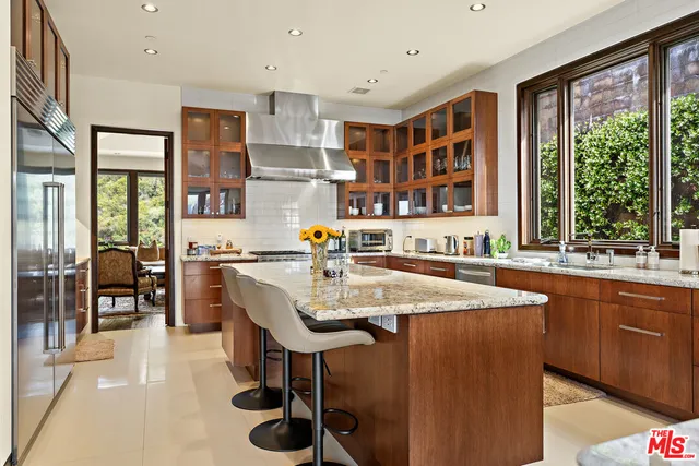 a dining table with chairs and window