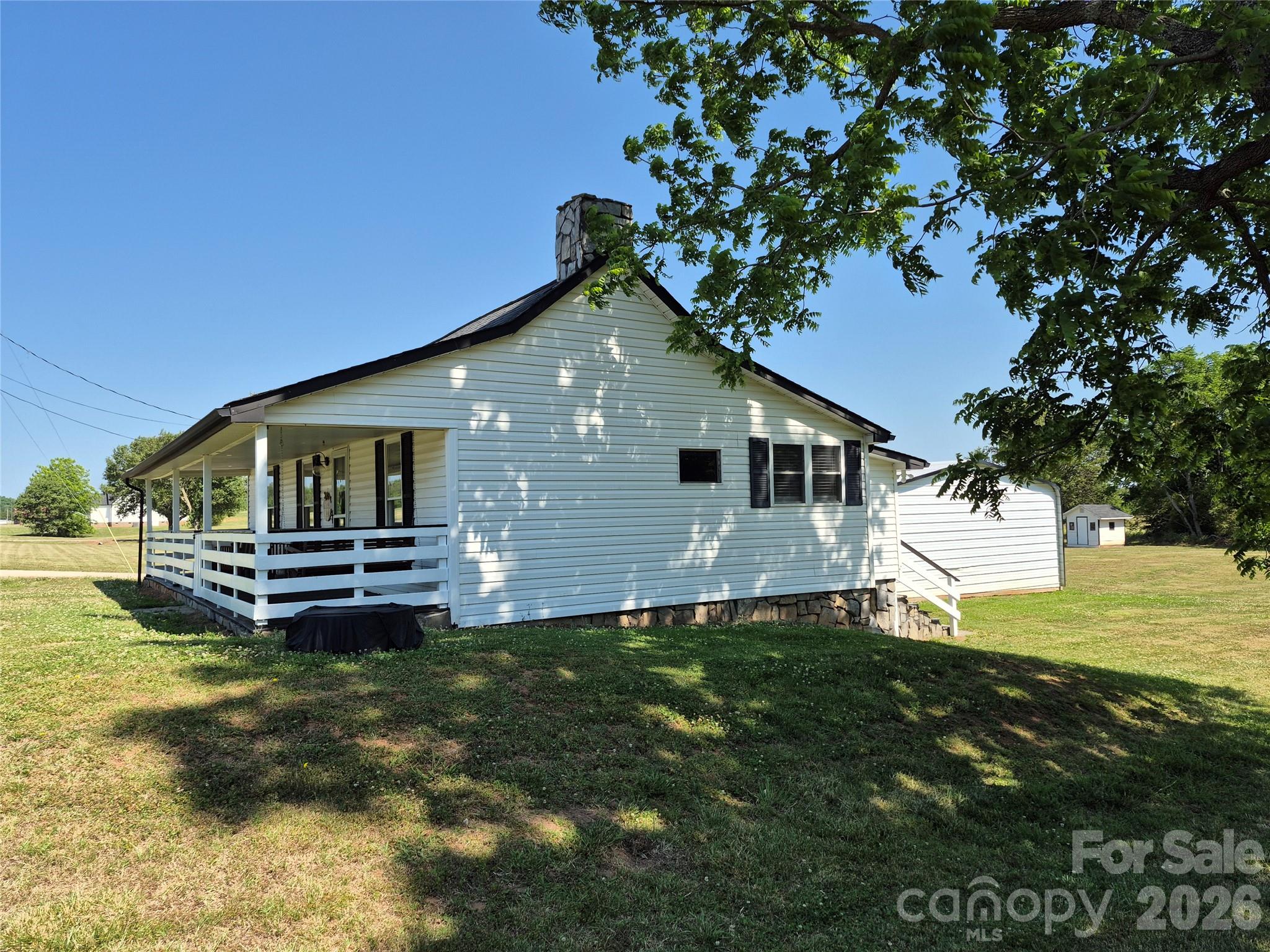 4438 Reepsville Road Vale, NC 28168 - Photo 4 of 32 a front view of a house with a garden