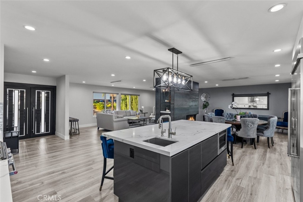 10126 Sully Drive Sun Valley, CA 91352 - Photo 11 of 34 a large kitchen with a table and chairs