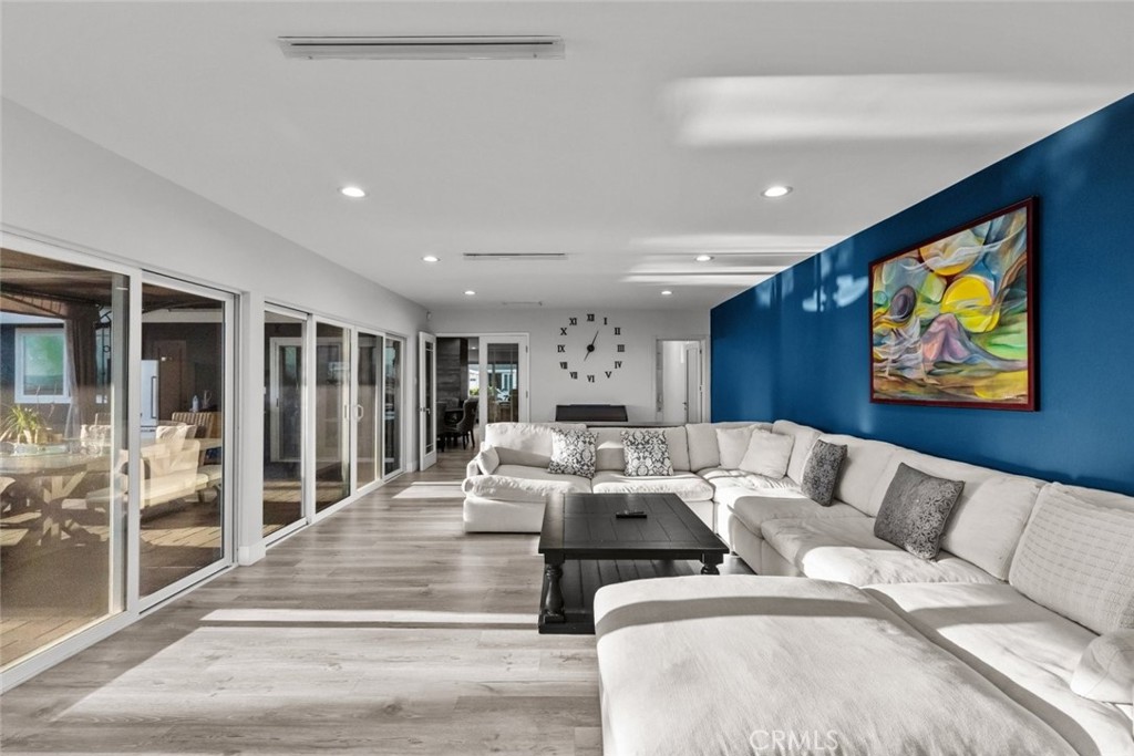 10126 Sully Drive Sun Valley, CA 91352 - Photo 16 of 34 a living room with furniture large window and glass wall