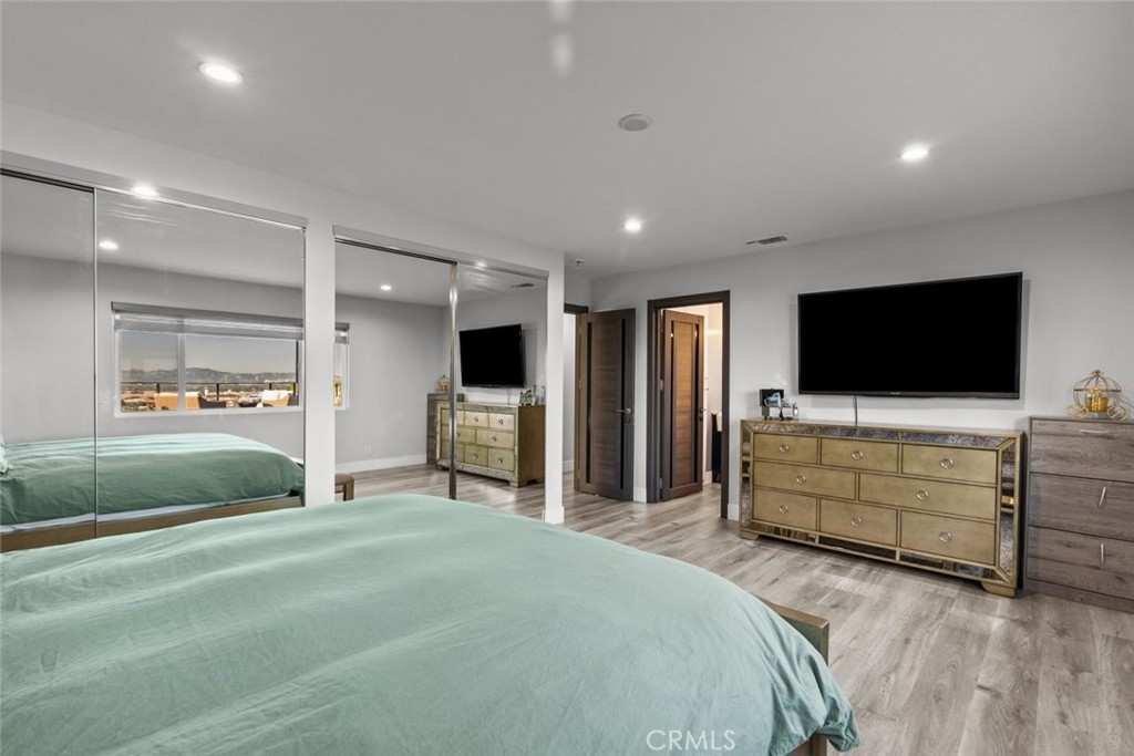 10126 Sully Drive Sun Valley, CA 91352 - Photo 19 of 34 a bedroom with furniture and a flat screen tv