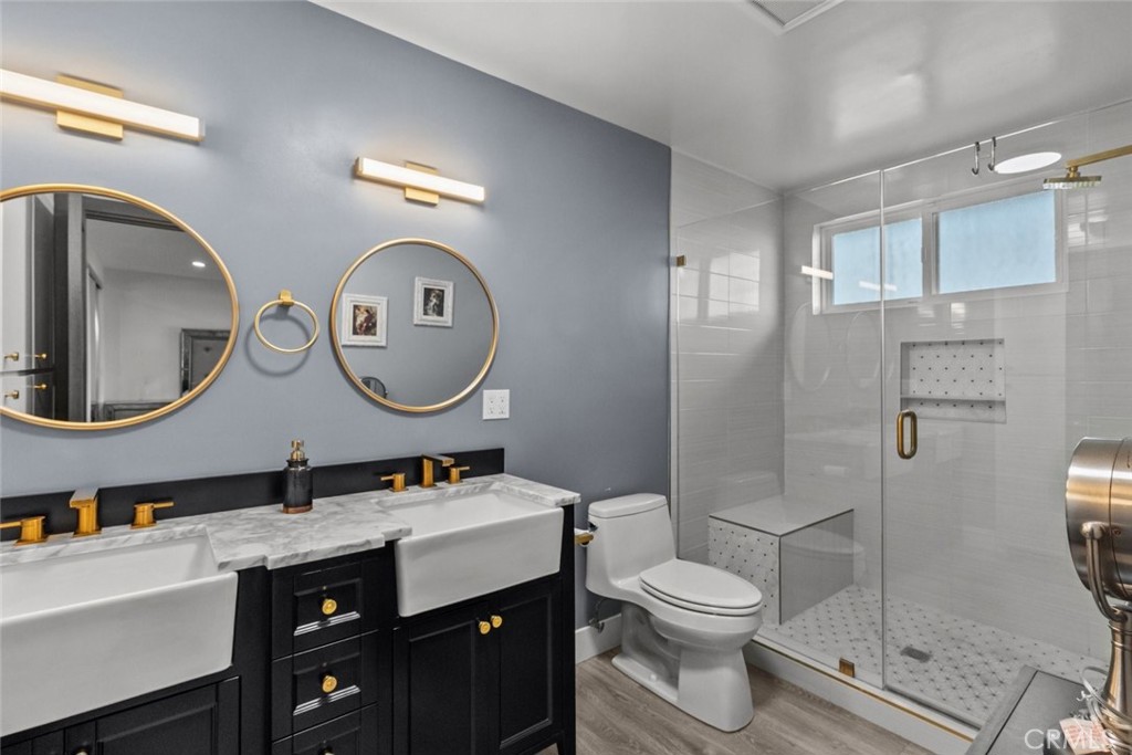 10126 Sully Drive Sun Valley, CA 91352 - Photo 20 of 34 a bathroom with a toilet a sink and a mirror