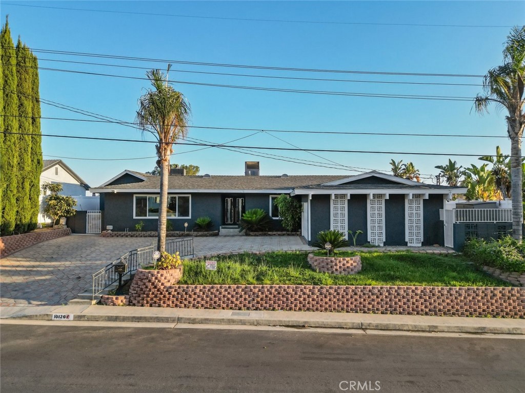 10126 Sully Drive Sun Valley, CA 91352 - Photo 2 of 34 a front view of a house with a yard