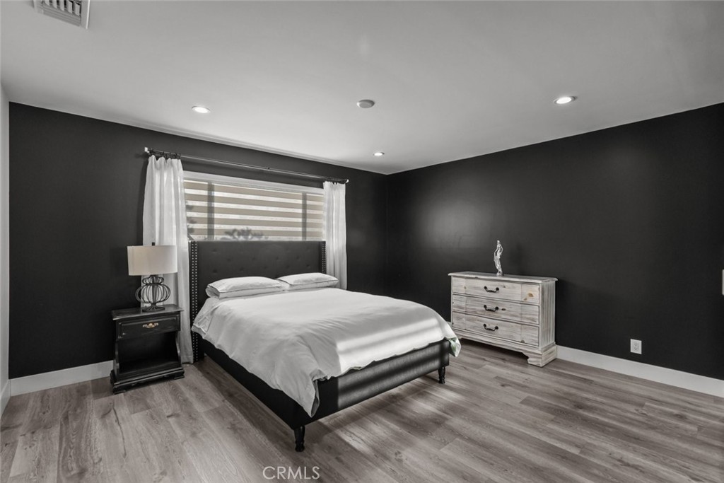 10126 Sully Drive Sun Valley, CA 91352 - Photo 21 of 34 a bedroom with a bed and window