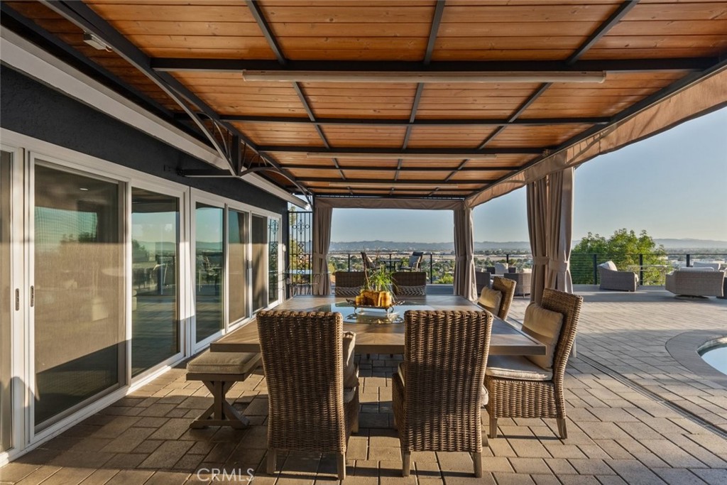 10126 Sully Drive Sun Valley, CA 91352 - Photo 25 of 34 a view of a porch with furniture and a table
