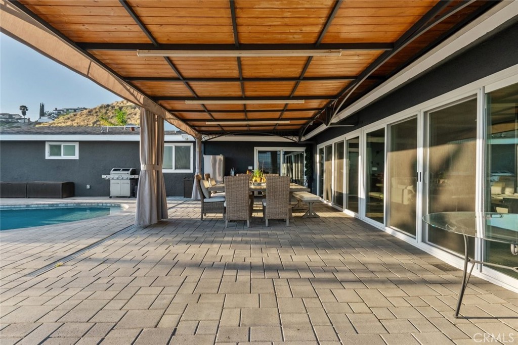 10126 Sully Drive Sun Valley, CA 91352 - Photo 26 of 34 a view of a porch with chairs and workspace
