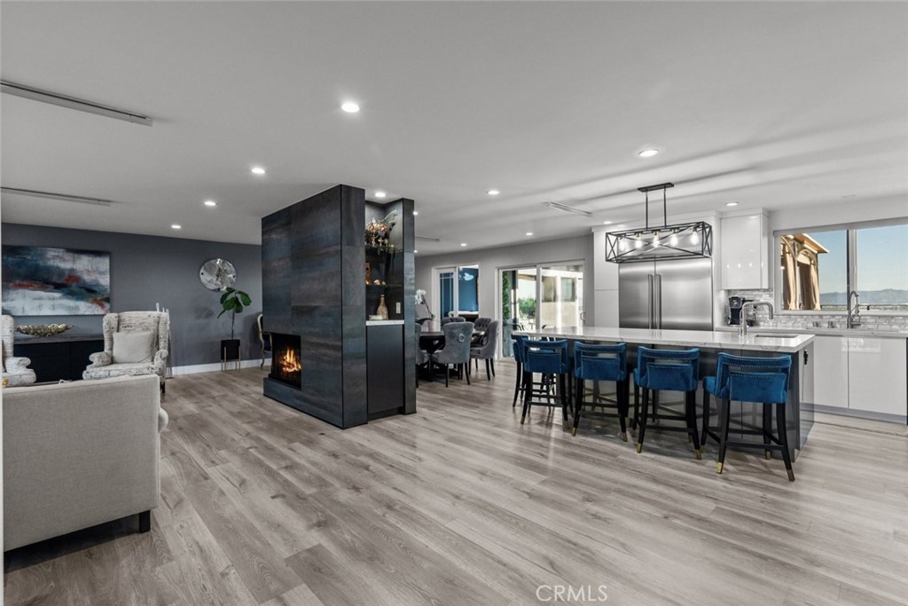 10126 Sully Drive Sun Valley, CA 91352 - Photo 7 of 34 a living room with furniture a dining table and kitchen view