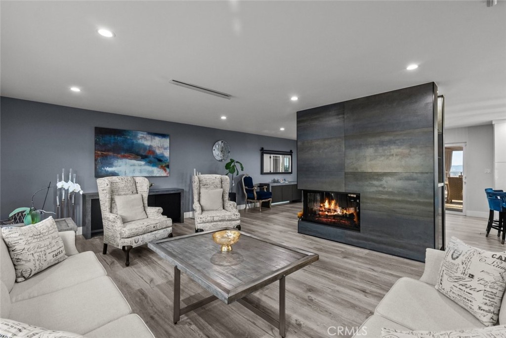 10126 Sully Drive Sun Valley, CA 91352 - Photo 8 of 34 a living room with furniture and a fireplace