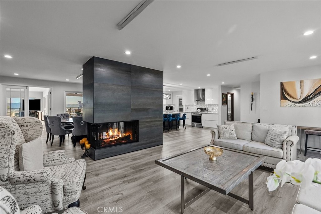 10126 Sully Drive Sun Valley, CA 91352 - Photo 9 of 34 a living room with furniture and a fireplace