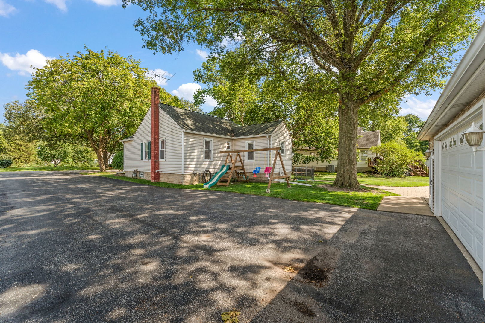 710 Elliott Street Beecher, IL 60401 - Photo 20 of 21 a view of a house with a backyard