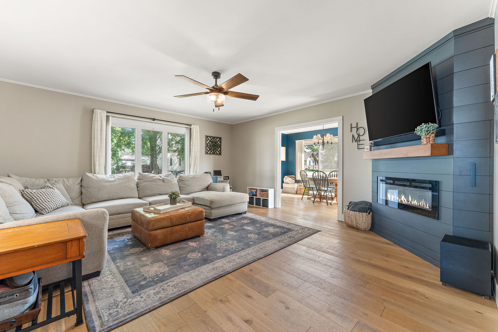 710 Elliott Street Beecher, IL 60401 - Photo 4 of 21 a living room with fireplace furniture and a flat screen tv
