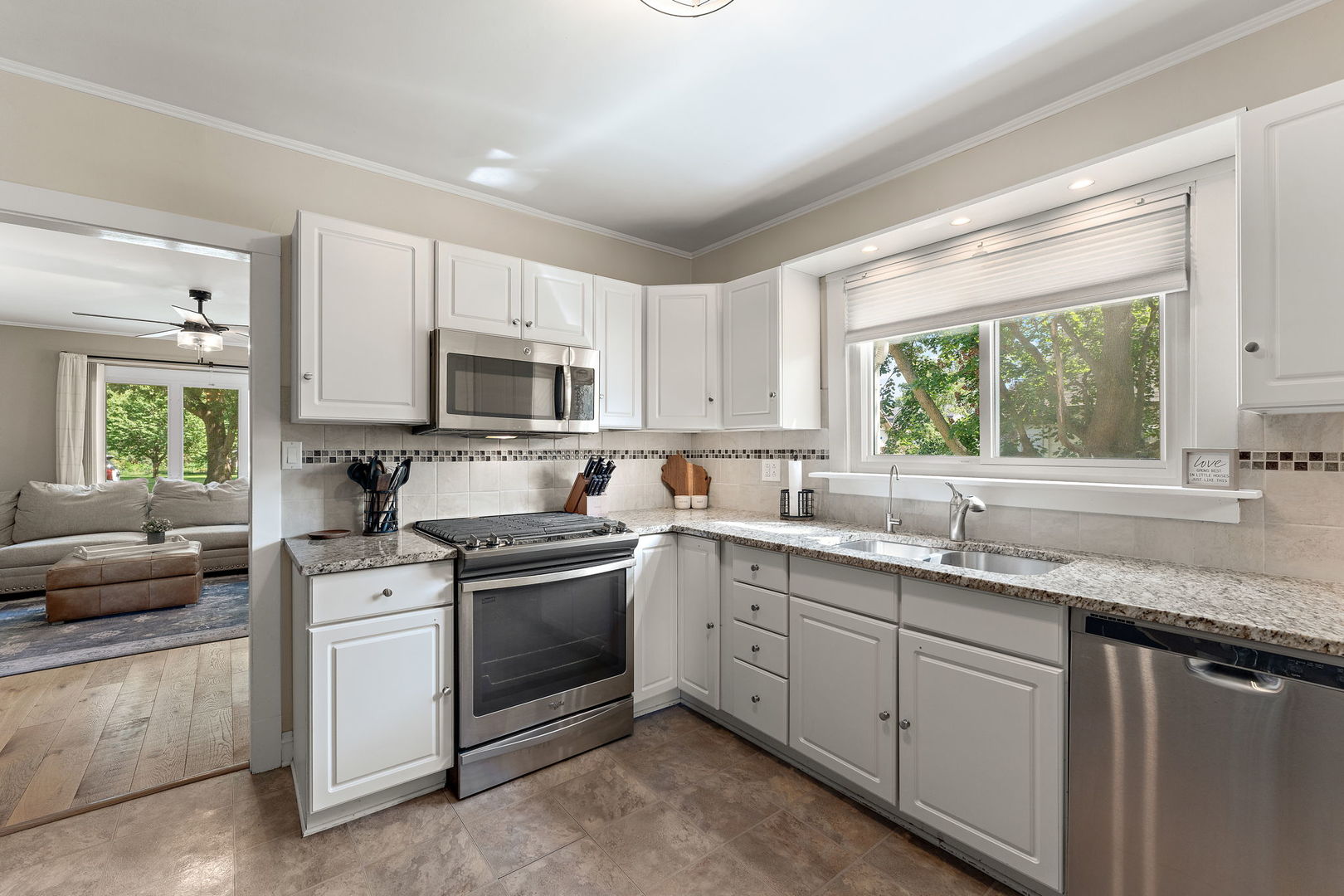 710 Elliott Street Beecher, IL 60401 - Photo 6 of 21 a kitchen with a sink stove oven and window