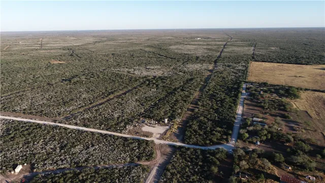 an aerial view of house with yard
