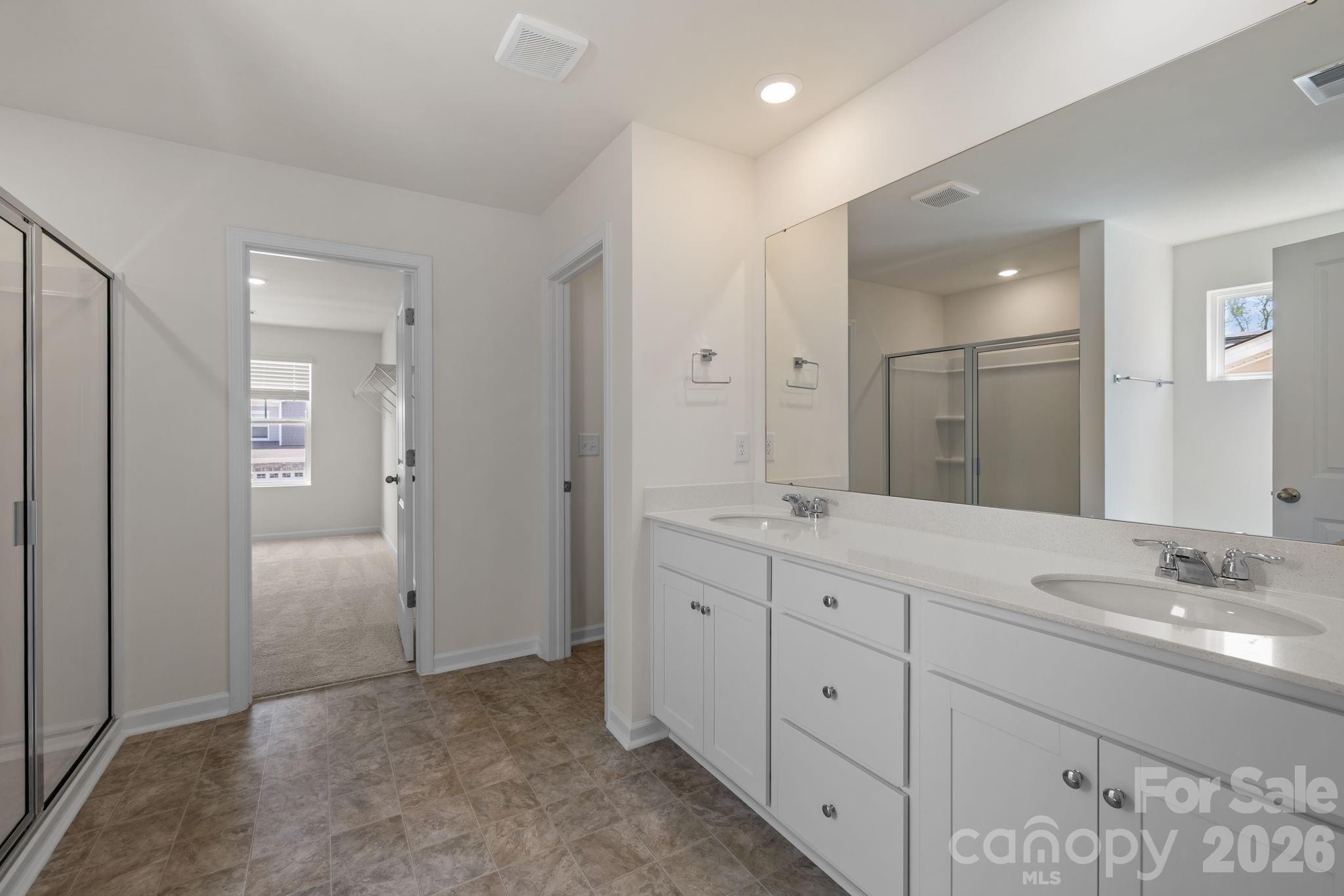 463 Brick House Road York, SC 29745 - Photo 23 of 35 a spacious bathroom with a granite countertop sink mirror and shower