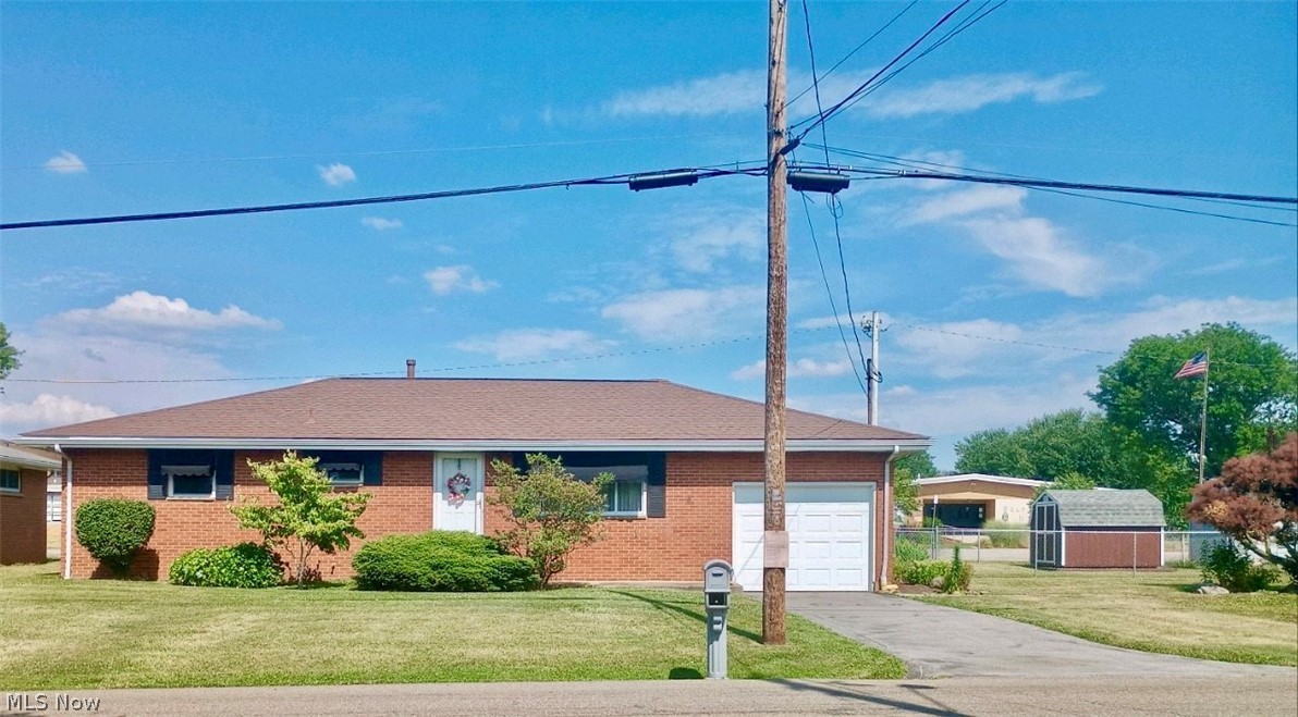 304 Stone Road Belpre, OH 45714 - Photo 2 of 34 Single story home featuring a garage and a front yard