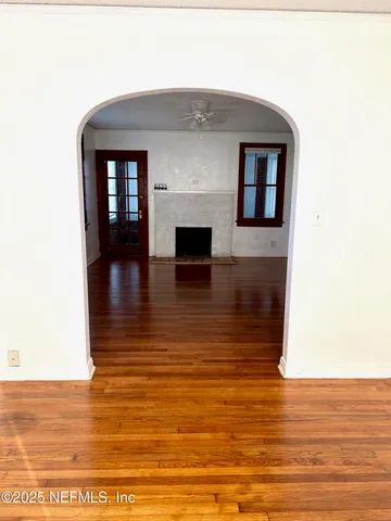 a view of a living room with a fireplace