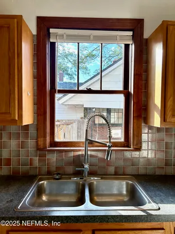 a kitchen sink with a window