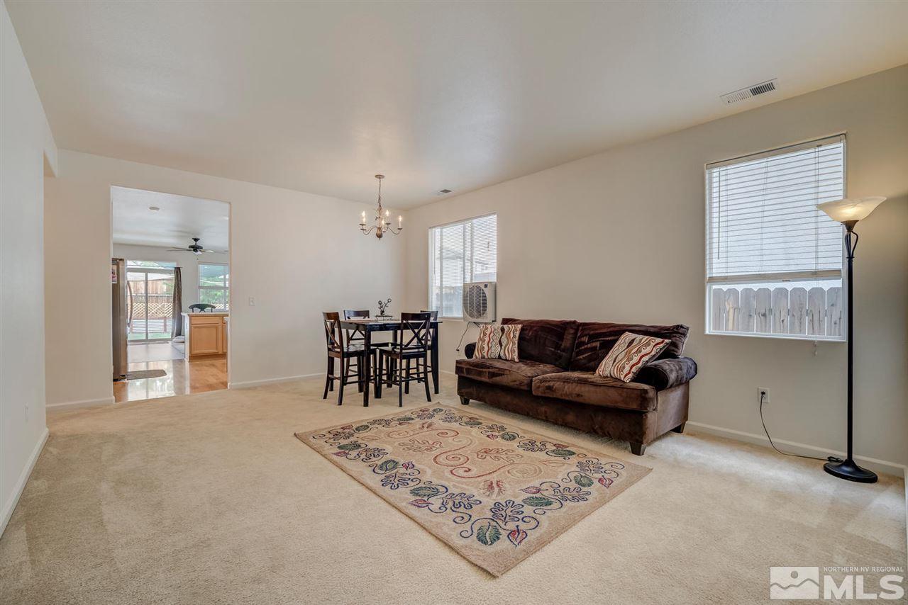 2271 Big Trail Circle Reno, NV 89521 - Photo 3 of 25 a living room with furniture and a dining table with kitchen view
