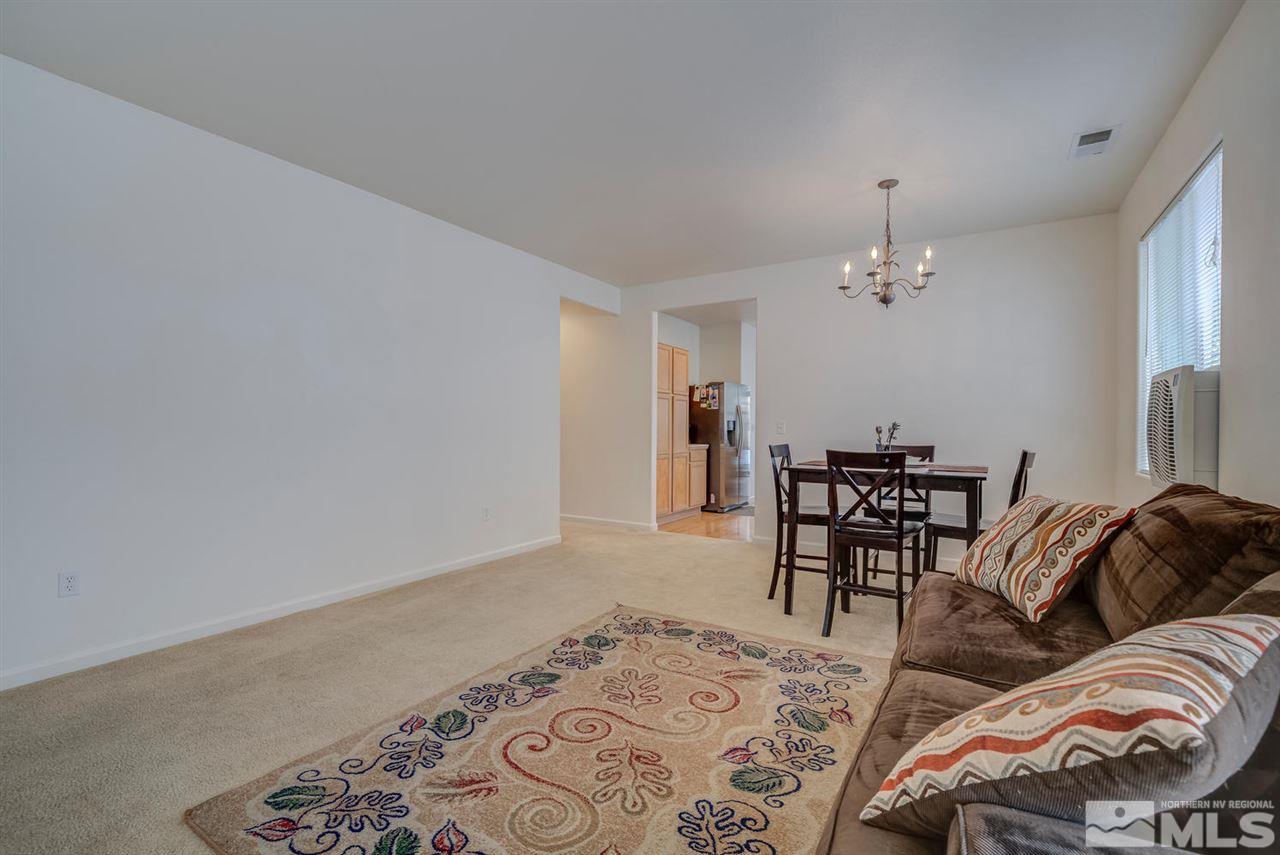 2271 Big Trail Circle Reno, NV 89521 - Photo 4 of 25 a living room with furniture and a dining table
