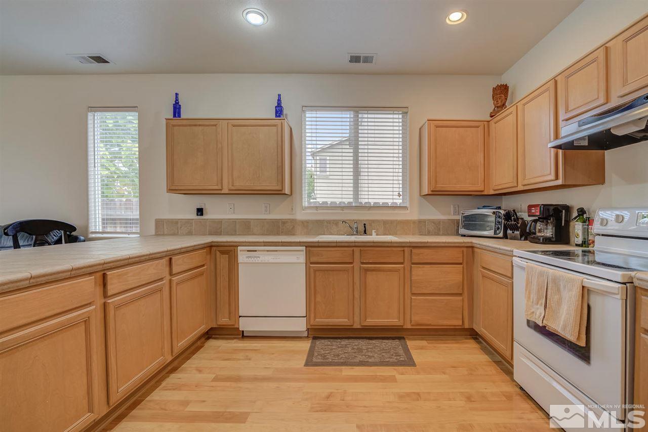 2271 Big Trail Circle Reno, NV 89521 - Photo 7 of 25 a kitchen with cabinets appliances and a window