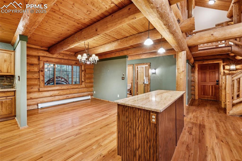 17522 Abert Ridge View Colorado Springs, CO 80908 - Photo 13 of 46 a view of a hallway with wooden floor
