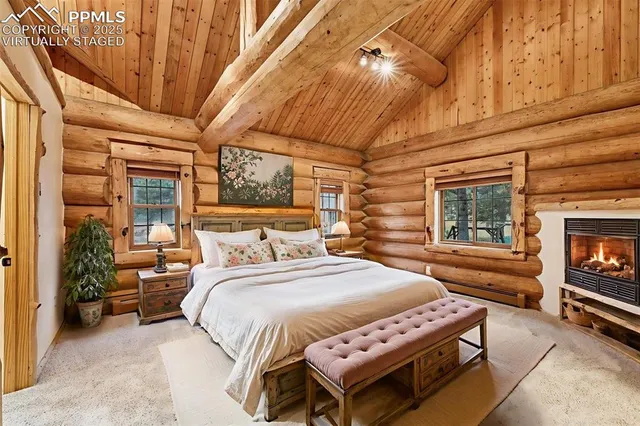 a bedroom with a bed couch and dresser