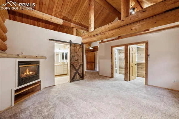 a view of an empty room with a fireplace