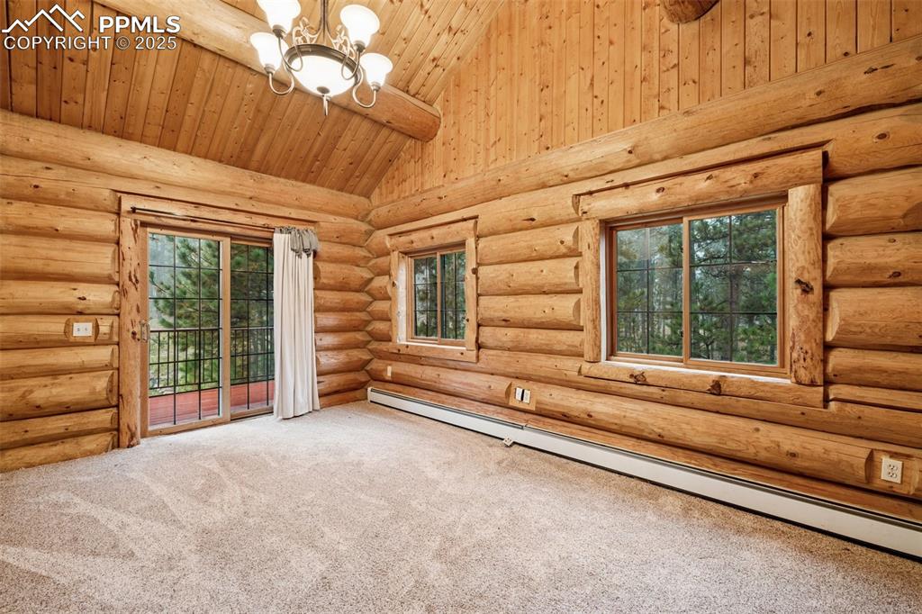 17522 Abert Ridge View Colorado Springs, CO 80908 - Photo 22 of 46 a view of a room with wooden floor and balcony