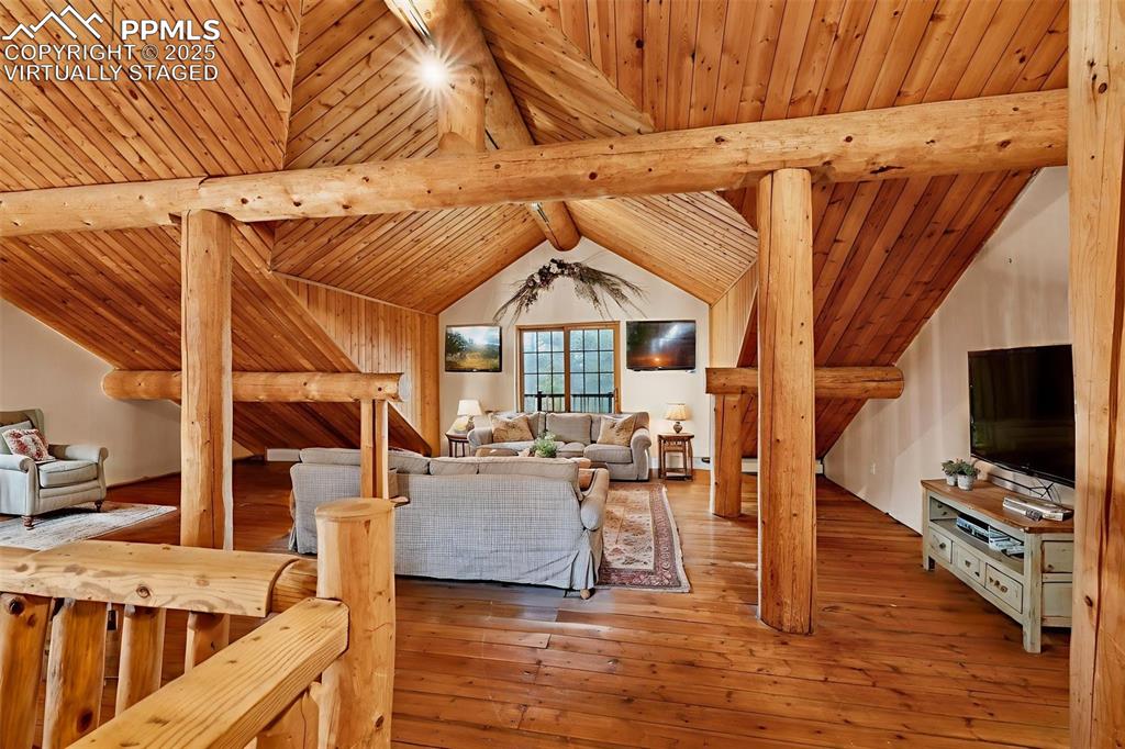 17522 Abert Ridge View Colorado Springs, CO 80908 - Photo 26 of 46 a living room with furniture and a flat screen tv