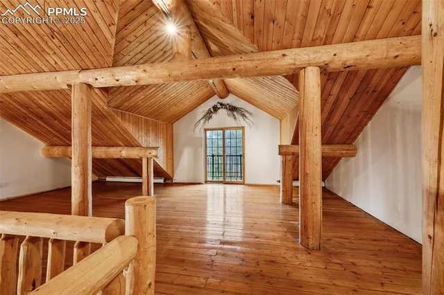 a view of an entryway with wooden floor