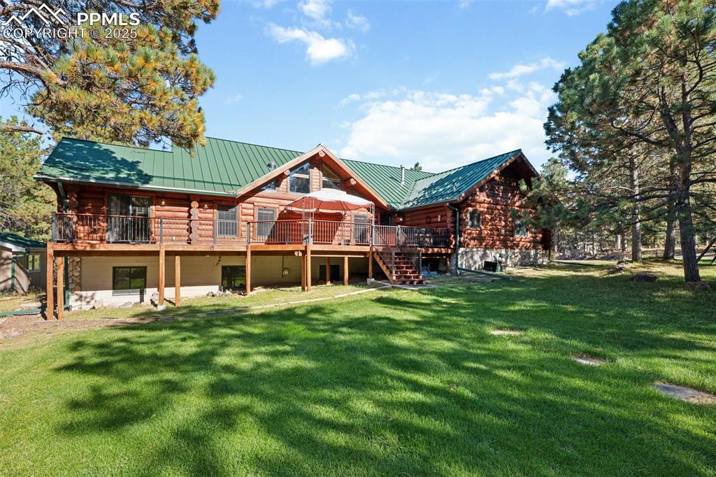 17522 Abert Ridge View Colorado Springs, CO 80908 - Photo 3 of 46 a front view of a house with a garden