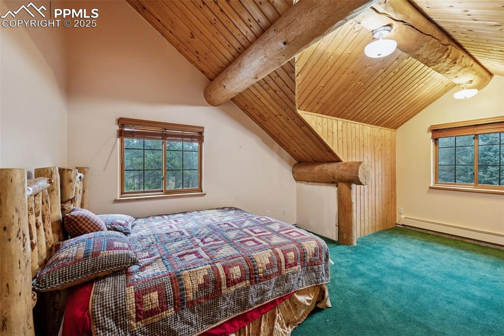 17522 Abert Ridge View Colorado Springs, CO 80908 - Photo 31 of 46 a bedroom with a bed and a window